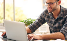 A man on a laptop.